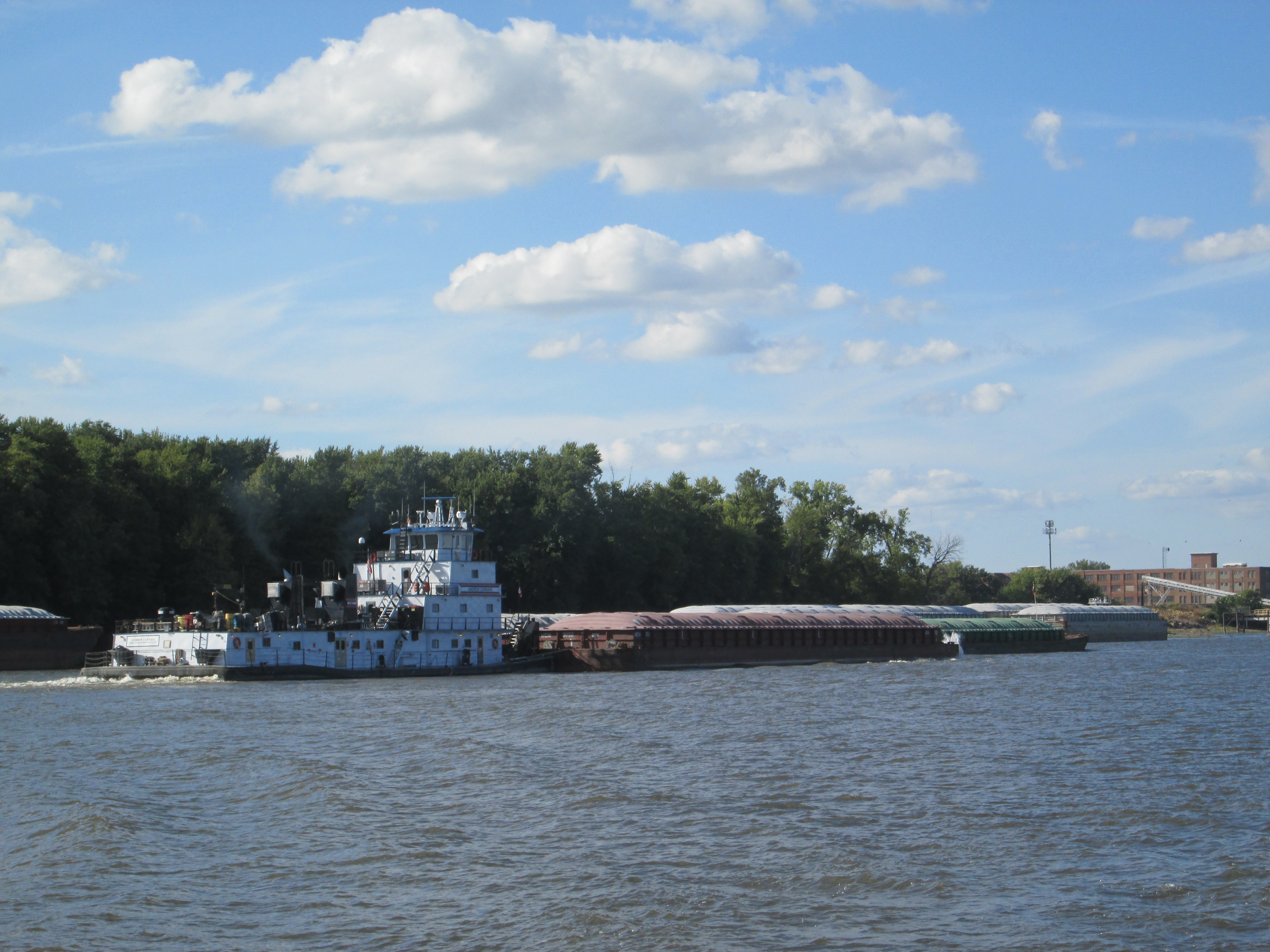 A barge two moving up river